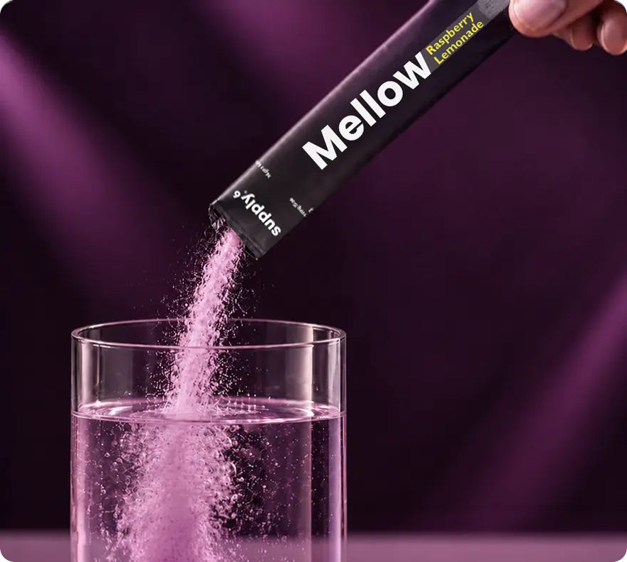 Pouring Mellow into a glass of water